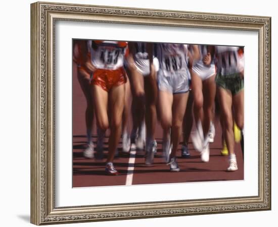 Blurred Action of Women Runners During a Track Race-Steven Sutton-Framed Photographic Print