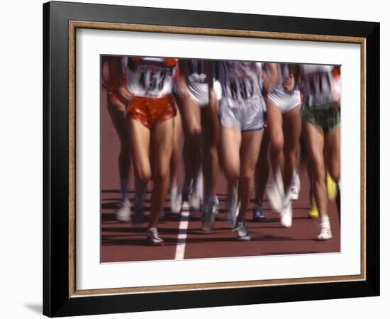 Blurred Action of Women Runners During a Track Race-Steven Sutton-Framed Photographic Print