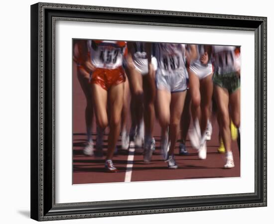 Blurred Action of Women Runners During a Track Race-Steven Sutton-Framed Photographic Print