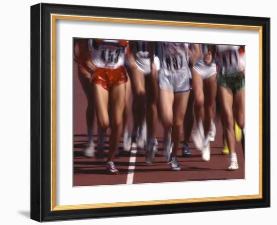 Blurred Action of Women Runners During a Track Race-Steven Sutton-Framed Photographic Print