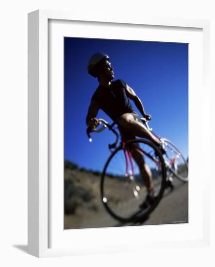 Blurred View of Cyclist-null-Framed Photographic Print