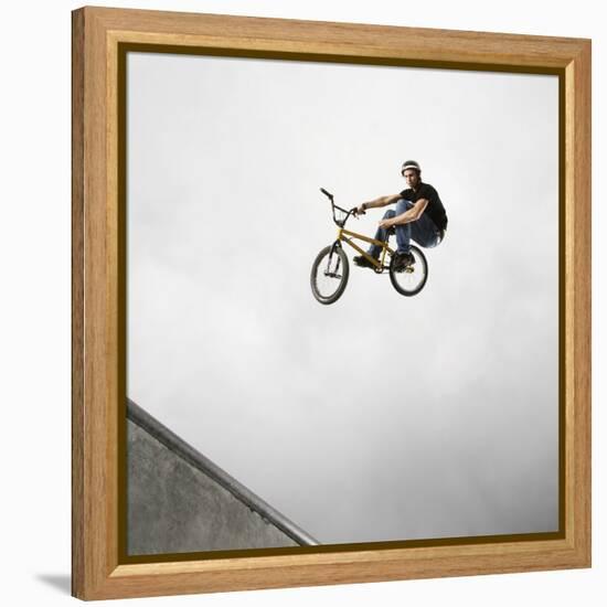 BMX Biker Performing Tricks-null-Framed Premier Image Canvas