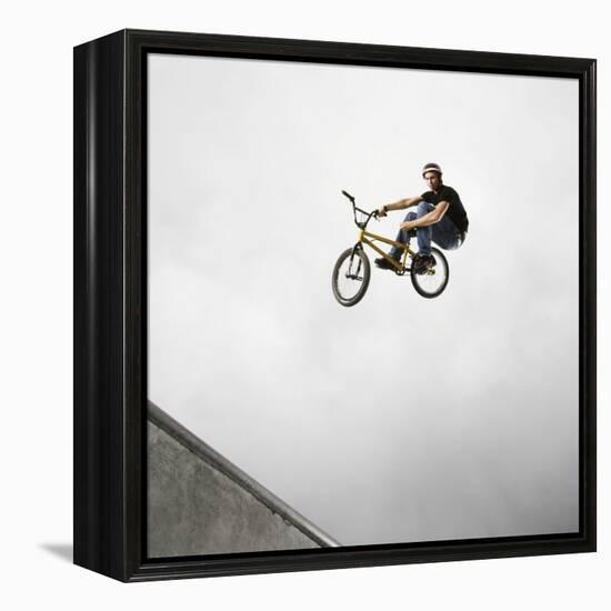 BMX Biker Performing Tricks-null-Framed Premier Image Canvas