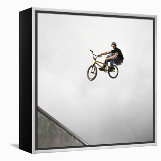 BMX Biker Performing Tricks-null-Framed Premier Image Canvas