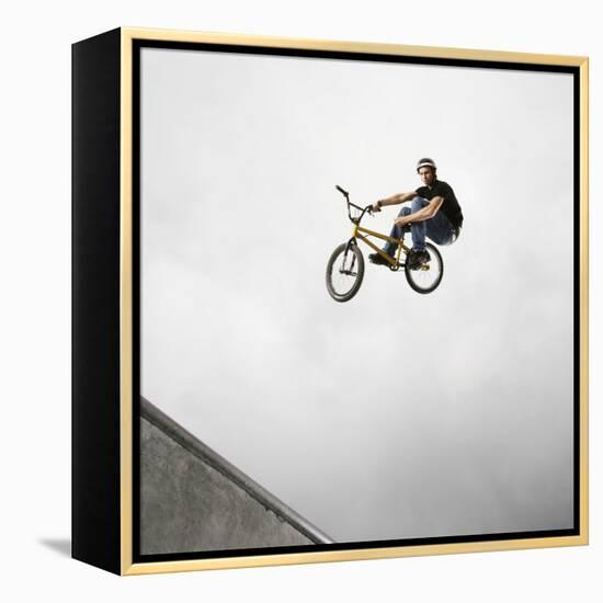 BMX Biker Performing Tricks-null-Framed Premier Image Canvas