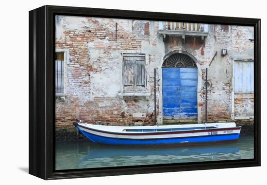 Boat And Blue Door. Venice. Venezia Province. Veneto. Italy-Oscar Dominguez-Framed Premier Image Canvas