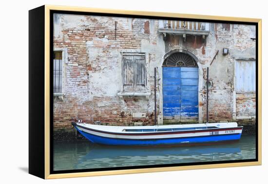 Boat And Blue Door. Venice. Venezia Province. Veneto. Italy-Oscar Dominguez-Framed Premier Image Canvas