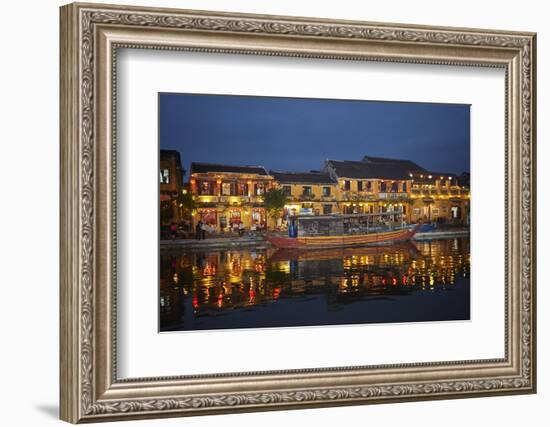 Boat and restaurants reflected in Thu Bon River at dusk, Hoi An, Vietnam-David Wall-Framed Photographic Print