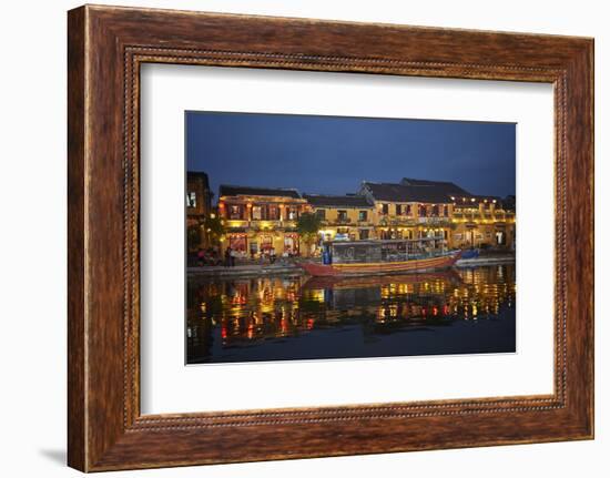 Boat and restaurants reflected in Thu Bon River at dusk, Hoi An, Vietnam-David Wall-Framed Photographic Print