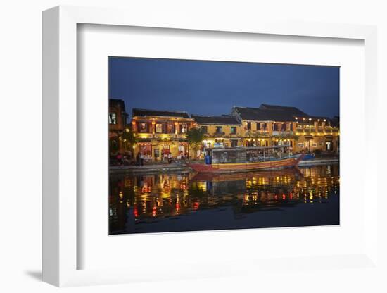 Boat and restaurants reflected in Thu Bon River at dusk, Hoi An, Vietnam-David Wall-Framed Photographic Print