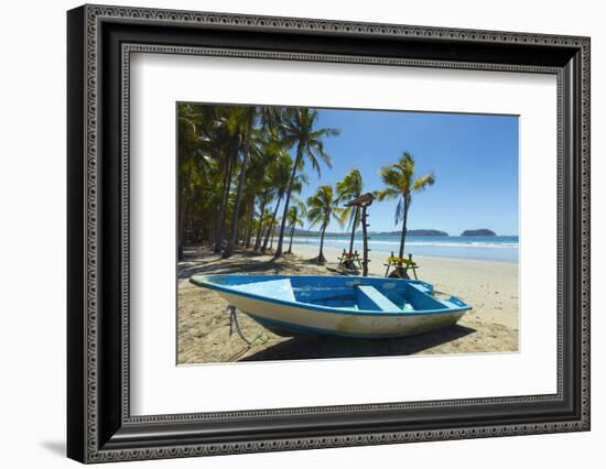 Boat on the Palm-Fringed Beach at This Laid-Back Village and Resort-Rob Francis-Framed Photographic Print