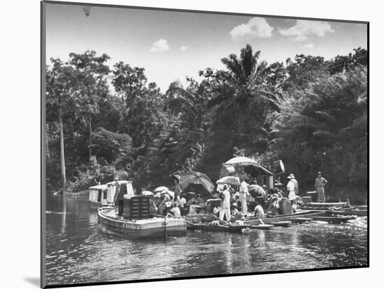 Boating Floating on the River Where the Shooting of the Movie "The African Queen" Is Taking Place-null-Mounted Photographic Print