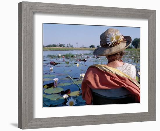 Boatman in His Dug-Out Canoe Takes a Tourist Game Viewing Along One of the Myriad Waterways of the -Nigel Pavitt-Framed Photographic Print