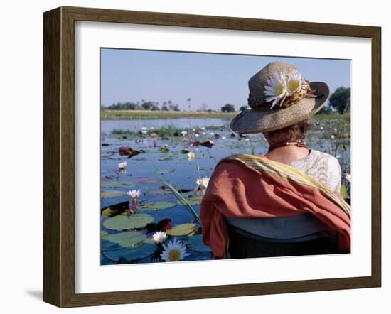 Boatman in His Dug-Out Canoe Takes a Tourist Game Viewing Along One of the Myriad Waterways of the -Nigel Pavitt-Framed Photographic Print