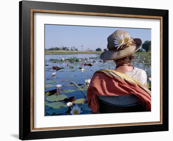 Boatman in His Dug-Out Canoe Takes a Tourist Game Viewing Along One of the Myriad Waterways of the -Nigel Pavitt-Framed Photographic Print