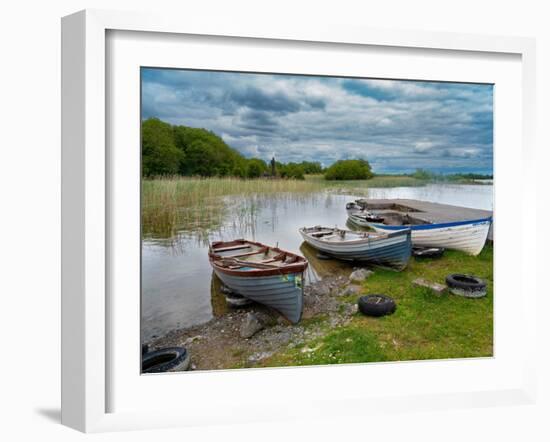 Boats await skippers on Lough Carra, County Mayo, Ireland. Shrine watches over the fishermen.-Betty Sederquist-Framed Photographic Print