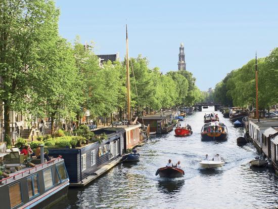 Boats Cruise Along A Canal With The Zuiderkerk Bell Tower In The Background Amsterdam Netherlands Photographic Print Miva Stock Art Com Boats Cruise Along A Canal With The Zuiderkerk Bell Tower In The Background Amsterdam Netherlands Photographic Print Miva Stock Art Com