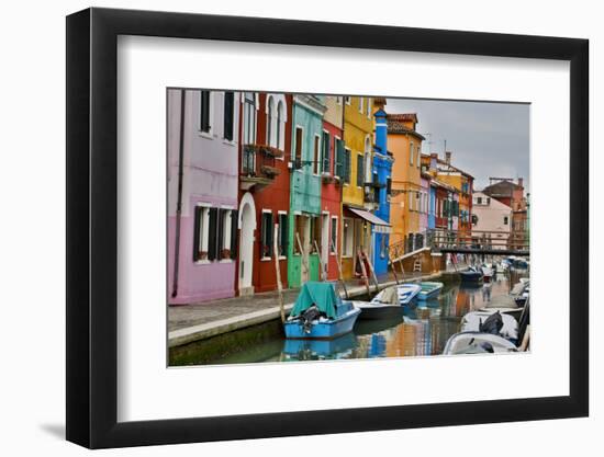 Boats Docked Along Canal with the Colorful Homes of Burano, Italy-Darrell Gulin-Framed Photographic Print
