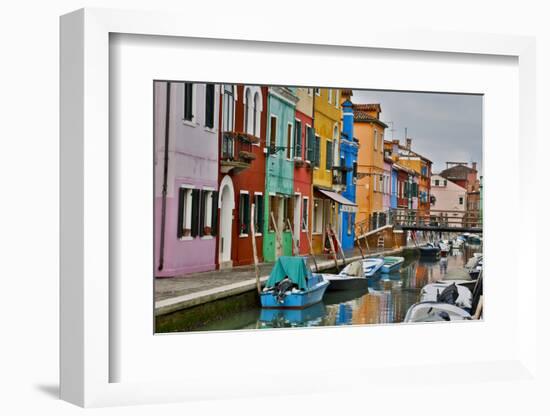 Boats Docked Along Canal with the Colorful Homes of Burano, Italy-Darrell Gulin-Framed Photographic Print