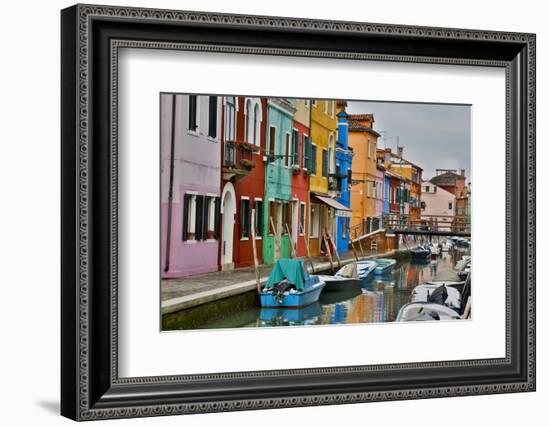 Boats Docked Along Canal with the Colorful Homes of Burano, Italy-Darrell Gulin-Framed Photographic Print