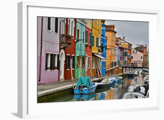 Boats Docked Along Canal with the Colorful Homes of Burano, Italy-Darrell Gulin-Framed Photographic Print