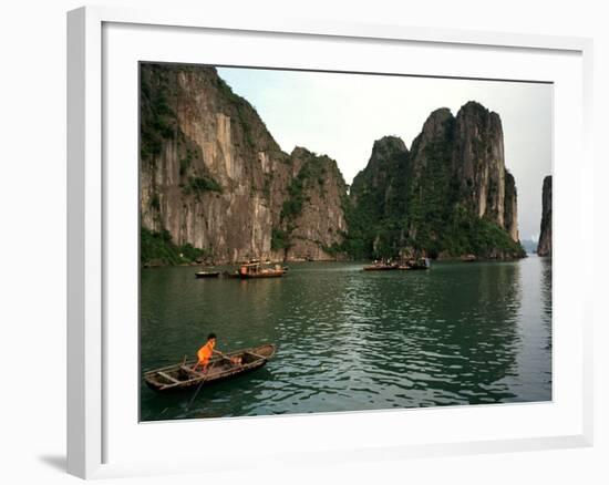 Boats Move Among the Craggy Islands of Halong Bay-null-Framed Photographic Print