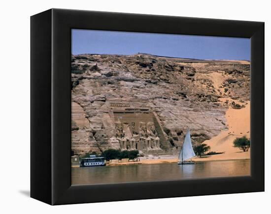 Boats on Nile River Passing Massive Statues of Pharoh Ramses II at Door to Queen Nefertari's Temple-James Burke-Framed Premier Image Canvas