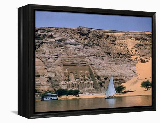 Boats on Nile River Passing Massive Statues of Pharoh Ramses II at Door to Queen Nefertari's Temple-James Burke-Framed Premier Image Canvas