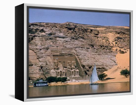 Boats on Nile River Passing Massive Statues of Pharoh Ramses II at Door to Queen Nefertari's Temple-James Burke-Framed Premier Image Canvas