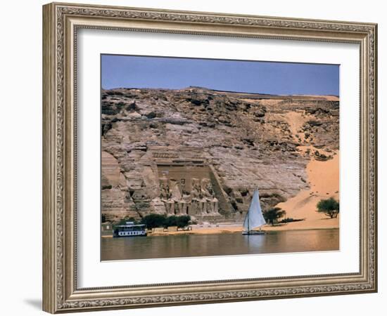 Boats on Nile River Passing Massive Statues of Pharoh Ramses II at Door to Queen Nefertari's Temple-James Burke-Framed Photographic Print