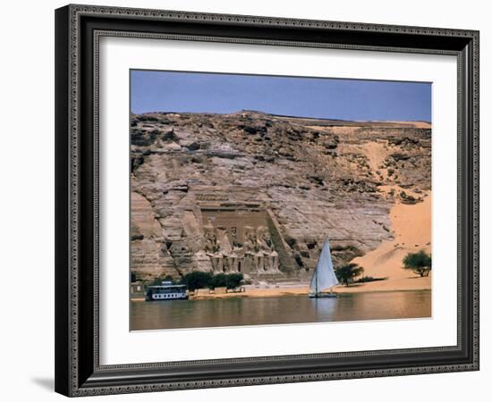 Boats on Nile River Passing Massive Statues of Pharoh Ramses II at Door to Queen Nefertari's Temple-James Burke-Framed Photographic Print