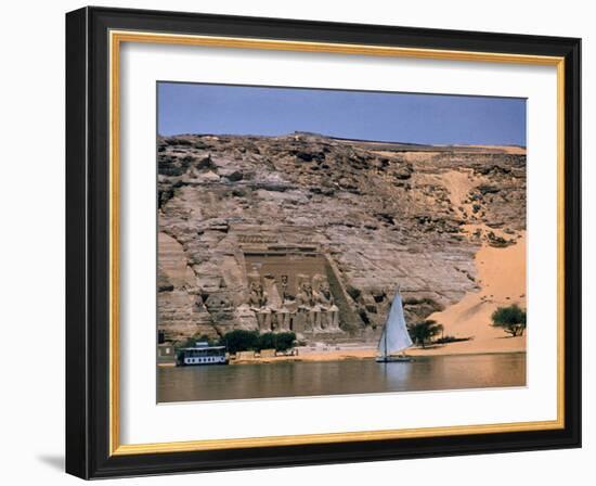 Boats on Nile River Passing Massive Statues of Pharoh Ramses II at Door to Queen Nefertari's Temple-James Burke-Framed Photographic Print