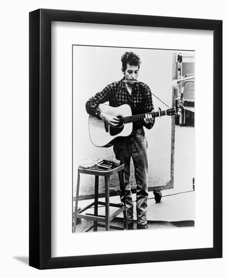 Bob Dylan Playing Guitar and Harmonica into Microphone. 1965--Framed Art Print