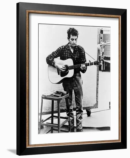 Bob Dylan Playing Guitar and Harmonica into Microphone. 1965-null-Framed Art Print