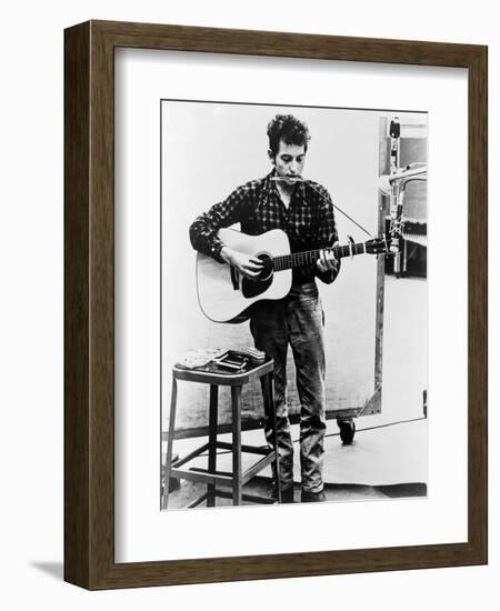 Bob Dylan Playing Guitar and Harmonica into Microphone. 1965-null-Framed Premium Giclee Print