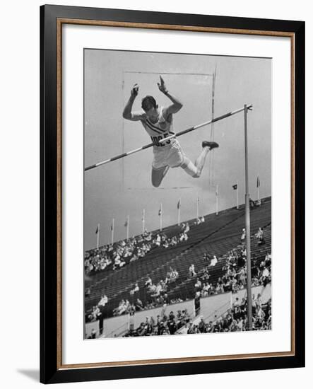 Bob Richards Competing in the High Jump at 1952 Olympics-Ralph Crane-Framed Premium Photographic Print