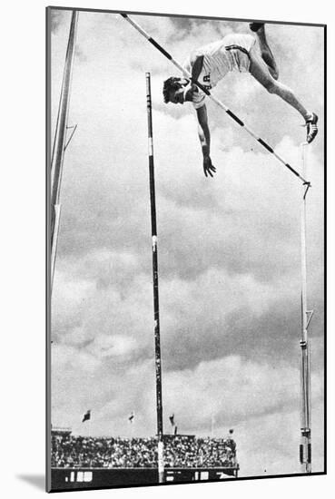 Bob Richards Winning the Gold Medal for the Pole Vault in the 1956 Melbourne Olympics-null-Mounted Photographic Print