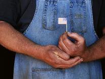Man Holding Small American Flag-Bob Rowan-Premier Image Canvas
