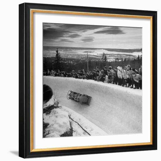 Bobsled Racing by on a Big Vendleboe Curve During the Winter Olympics-Nat Farbman-Framed Premium Photographic Print