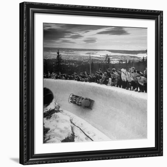 Bobsled Racing by on a Big Vendleboe Curve During the Winter Olympics-Nat Farbman-Framed Premium Photographic Print