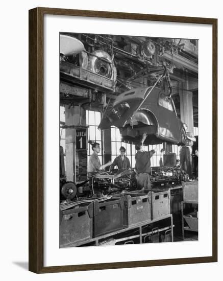 Body Being Lowered on to "Topolino" Chassis by Workers on Assembly Line at Fiat Production Plant-Alfred Eisenstaedt-Framed Premium Photographic Print