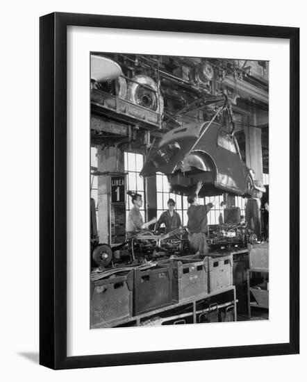 Body Being Lowered on to "Topolino" Chassis by Workers on Assembly Line at Fiat Production Plant-Alfred Eisenstaedt-Framed Photographic Print
