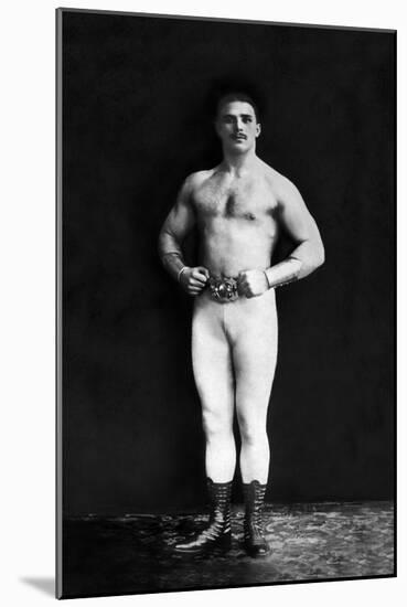 Bodybuilder in Leotard and Boots-null-Mounted Art Print