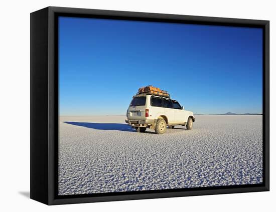 Bolivia, Potosi Department, Daniel Campos Province, White Toyota Landcruiser on the Salar de Uyuni,-Karol Kozlowski-Framed Premier Image Canvas