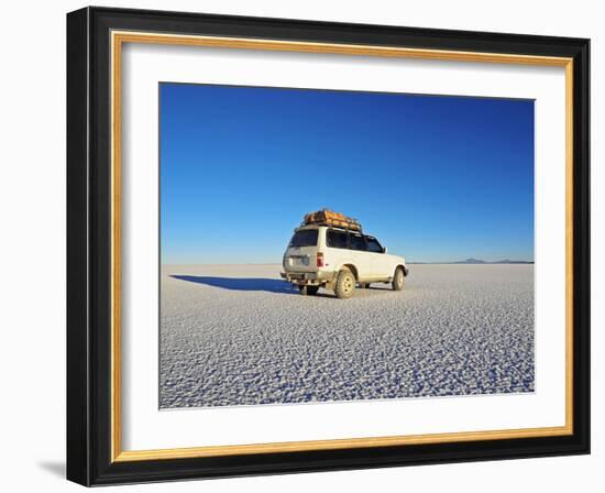 Bolivia, Potosi Department, Daniel Campos Province, White Toyota Landcruiser on the Salar de Uyuni,-Karol Kozlowski-Framed Photographic Print