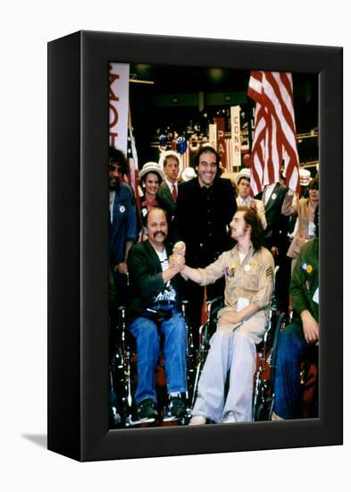 BORN ON THE FOURTH OF JULY, 1989 directed by OLIVER STONE On the set, Oliver Stone between Ron Kovi-null-Framed Stretched Canvas