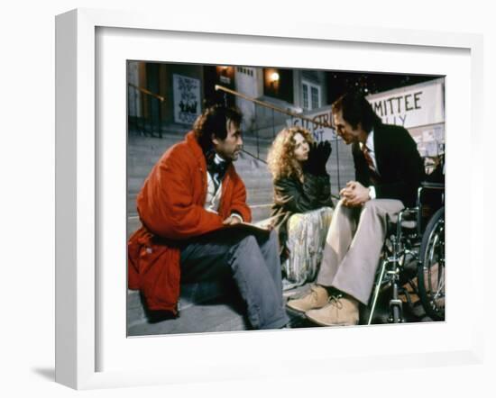 BORN ON THE FOURTH OF JULY, 1989 directed by OLIVER STONE On the set, Oliver Stone directs Kira Sed-null-Framed Photo