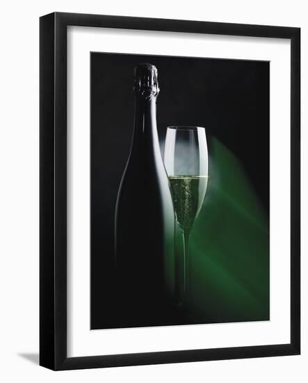 Bottle and Glass of Sparkling Wine in Green Light-null-Framed Photographic Print