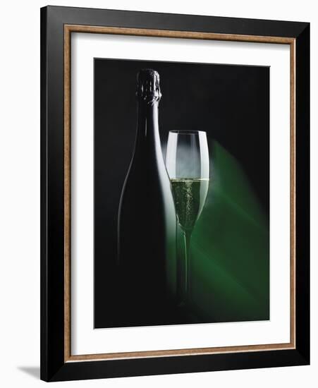 Bottle and Glass of Sparkling Wine in Green Light-null-Framed Photographic Print