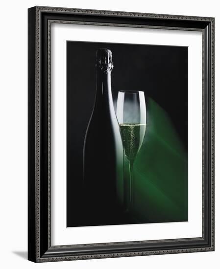 Bottle and Glass of Sparkling Wine in Green Light-null-Framed Photographic Print